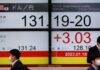 Asian markets swing as traders weigh growth outlook