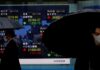 Asian shares rise, dollar staggers after ‘dovish’ Powell comments