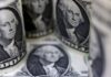 Dollar edges lower from six-week peak, Swedish crown jumps