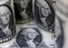 Dollar pulls back as Powell sticks to usual Fed playbook