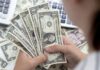 Dollar subdued as traders eye Powell testimony, jobs report