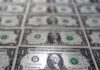 Safe-haven dollar slides as bank fears ease; yen surges