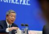 China will safeguard yuan and financial stability, central bank governor says