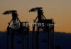 Japan raises view on imports, sees rising bankruptcies