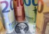 Dollar falls after Fed signals pause; banking woes dent confidence