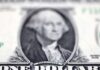 Dollar rises slightly, sterling hovers near one-year high
