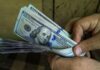 Dollar flat; Aussie slides as inflation slows