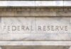 Fed holds rates steady, sees two small hikes by end of year