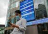 Asia shares slip as China casts a pall, dollar’s slide abates