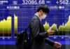 Asian shares fall after US tech falters, dollar and yields hold gains