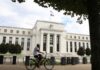 US Fed pauses rate hikes but predicts long fight against inflation
