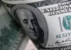 Dollar headed for second weekly gain on tempered rates outlook