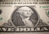 Dollar set for strongest week since July on reduced rate cut bets