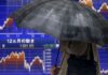Japanese shares hit near 34-year high on tech gain, weaker yen