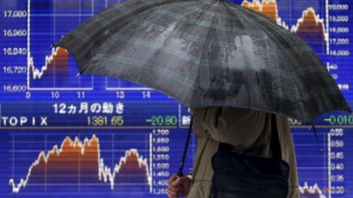 Japanese shares hit near 34-year high on tech gain, weaker yen