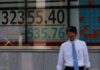 Asia stocks edge down; dollar rides Treasury yields higher