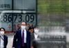 Asian shares meander as US inflation test awaits; kiwi slides