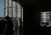 Hong Kong under pressure to ease property curbs, plug deficit in budget