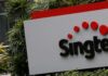 Singtel shares fall more than 1% after Optus stake sale reports