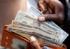 Dollar a tad softer as markets wait for Fed