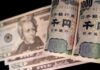 Yen clings to sharp gains after suspected intervention, Fed in focus
