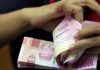 Foreigners sold Asian bonds in April amid firm dollar, Fed uncertainty