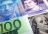Dollar rises, pound, Swiss franc drop on busy central bank day