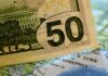Dollar slightly pares losses after Fed meeting statement