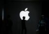 Apple cuts about 100 jobs in its services division, Bloomberg News reports