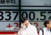 Asia shares edge up and dollar down; oil gains
