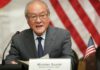 Japan closely watching stock moves but is not in a phase of action, finance minister says