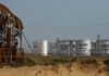Oil prices flat as lower demand signs outweigh US hurricane impact