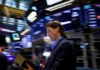 Wall St backs down amid mixed earnings, oil extends slide