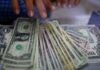 Dollar firms as Trump’s shifting messages on tariffs stir uncertainty