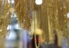 Gold holds near record peak as investors await Trump tariff plan