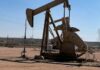 US oil prices drop more than $1 as inventory build raises oversupply fear