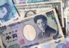 Dollar holds losses against yen after Trump announces Japan trade deal