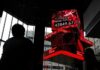 Shares nudge higher in Asia, oil slips on truce talks