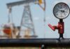 Oil holds in tight range as rising output offsets Russia supply disruptions