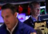 Stocks retreat, gold hits record as US government shutdown begins