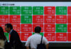 Asian markets tumble as tech bubble fears grow