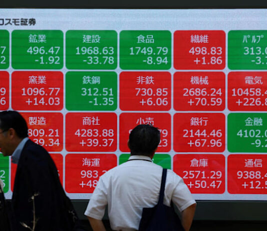 Asian markets tumble as tech bubble fears grow