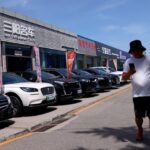 China to tighten oversight on new cars exported as used vehicles