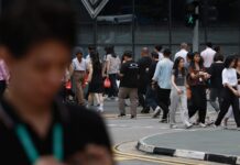 Less job switching, especially by those in their 20s, suggests growing caution among workers, says MOM