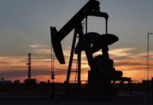 Oil becalmed as investors weigh hopes for Ukraine peace talks, US rate cut