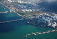 Oil prices edge down on US inventory build, OPEC forecast shift