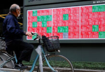 Tech rally drives Tokyo, Taipei stocks to record highs; US dollar gains