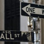 Wall St ends lower as bank CEOs warn of possible pullback, fuelling tech bubble jitters