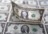 Yen slips to nine-month low; dollar edges up as shutdown set to end