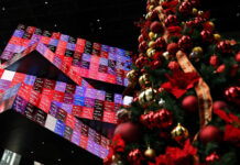 Asian markets mostly up after US growth fuels Wall Street record